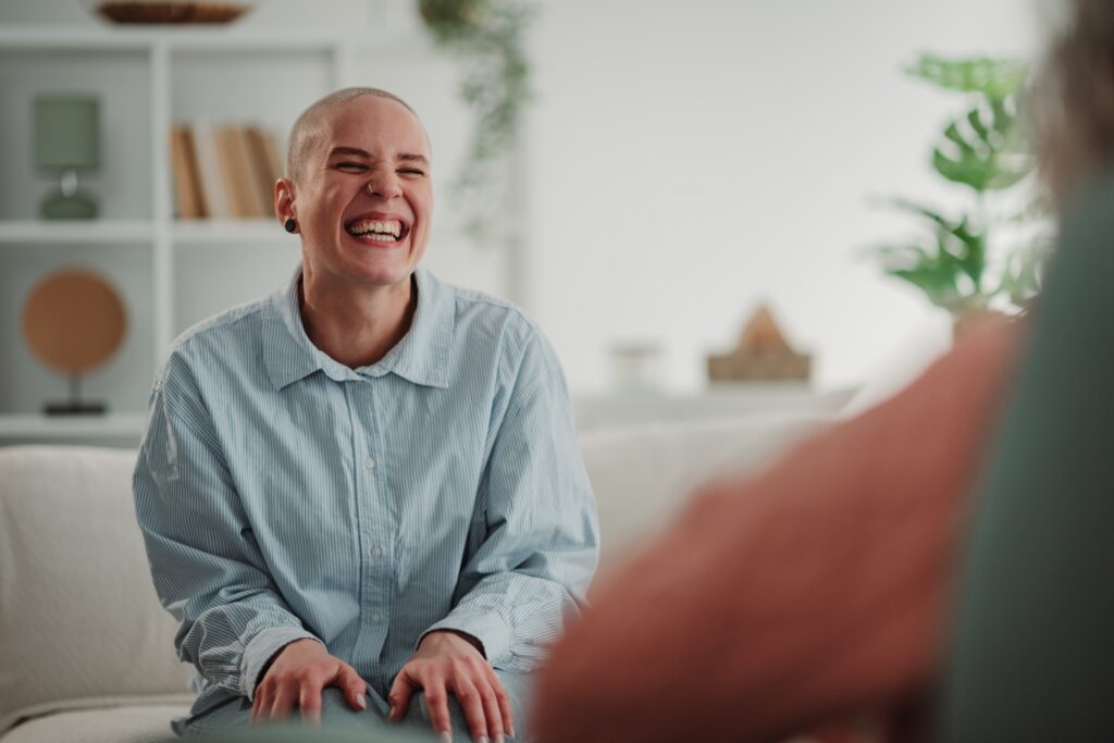 A person finding happiness and support in a therapy session