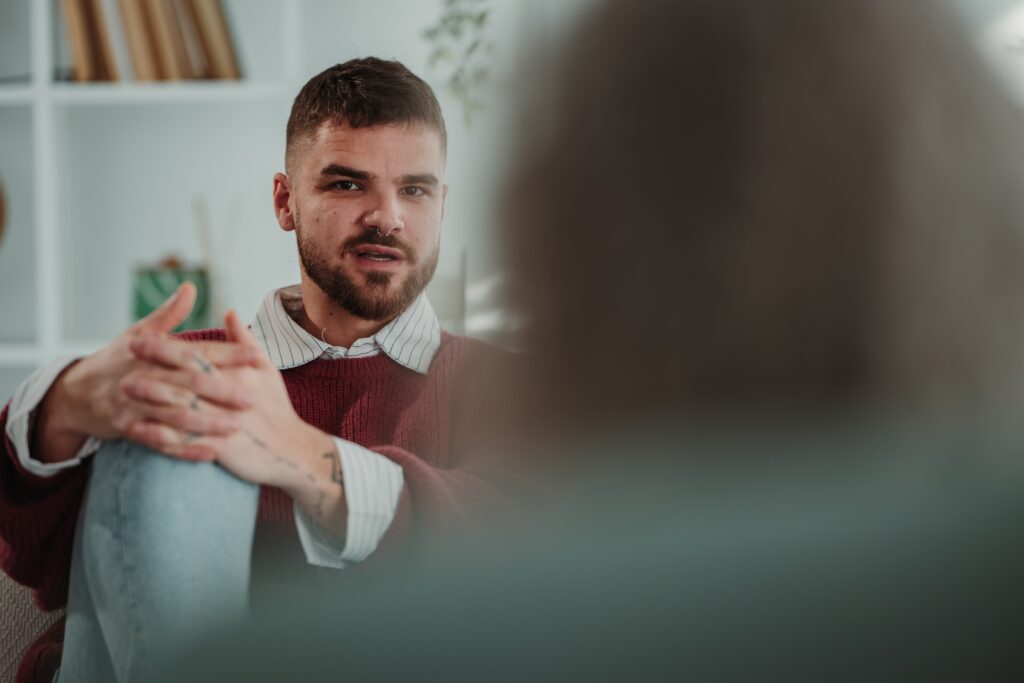 Young man, engaging in a counselling session